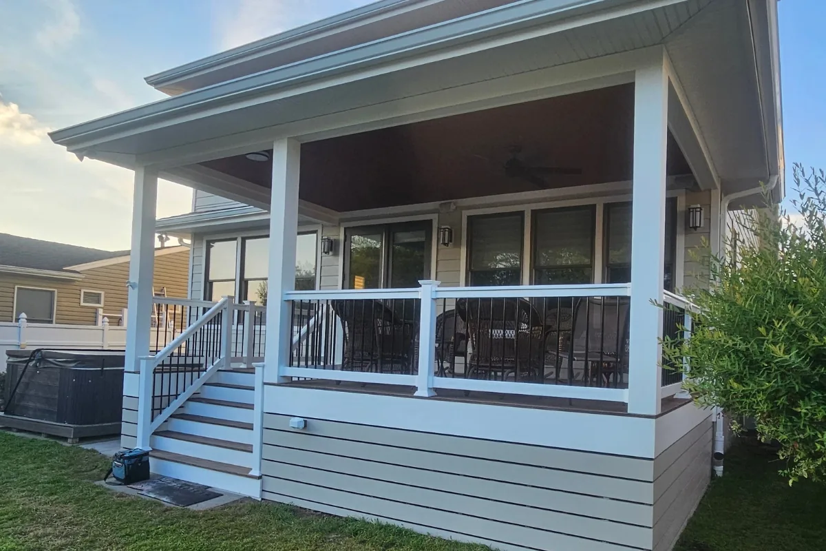 Close-up of James Hardie lap siding and white trim around a covered porch on a Lanoka Harbor, NJ home