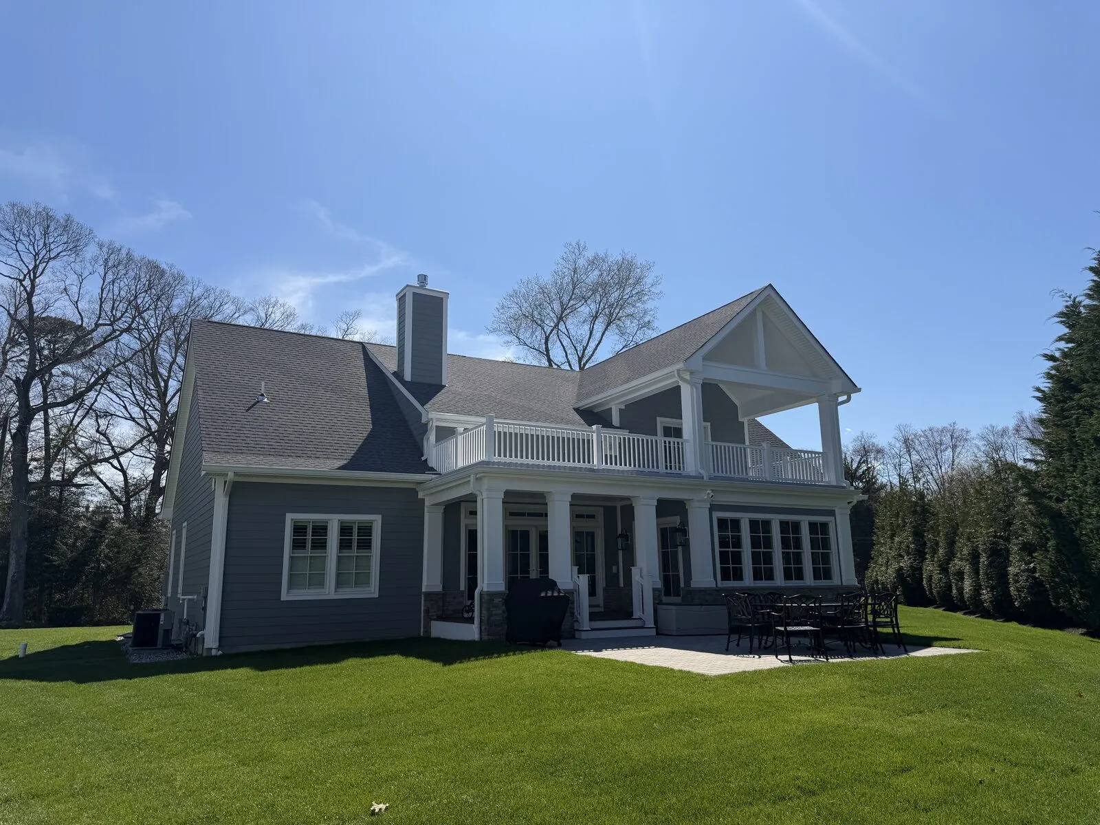 Rear-elevation siding and balcony detail on a Brick, NJ cape cod